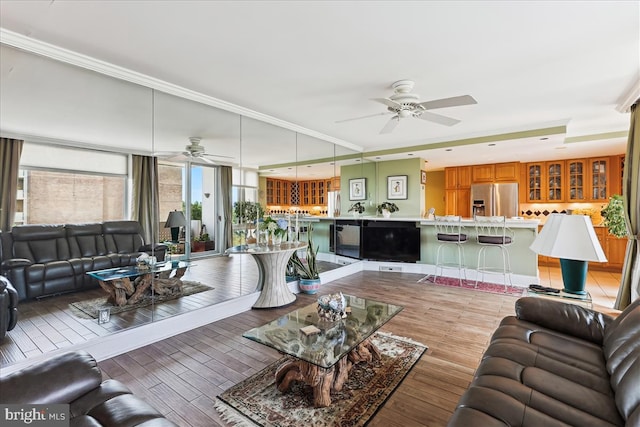 430 M St SW Unit N-609, Washington, DC 20024 - living area with a ceiling fan, light wood finished floors, and ornamental molding