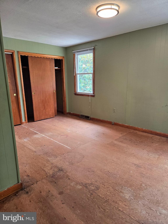 unfurnished bedroom with baseboards