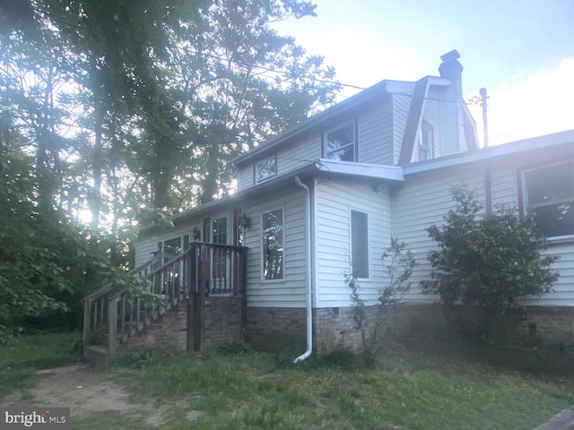 view of home's exterior featuring a chimney