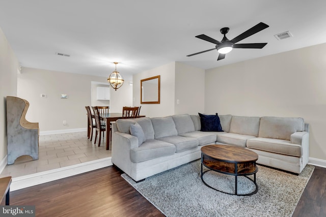 1458 Blockton Ct, Crofton, MD 21114 - living room featuring wood finished floors, baseboards, and ceiling fan