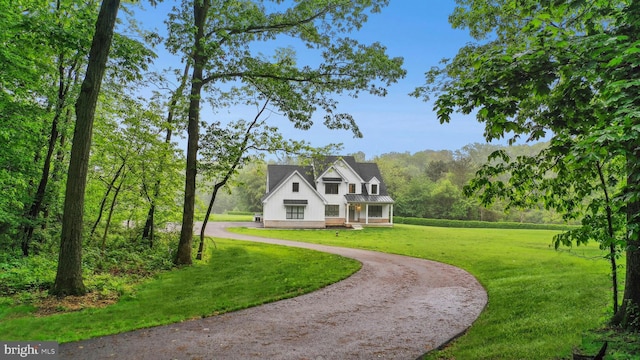 385 Nolf Rd, Nazareth, PA 18064 - modern farmhouse style home with a front yard, driveway, and board and batten siding