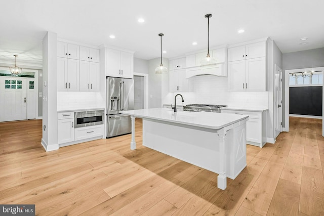 385 Nolf Rd, Nazareth, PA 18064 - kitchen with high end refrigerator, light countertops, backsplash, plenty of natural light, and recessed lighting