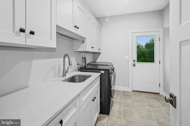 385 Nolf Rd, Nazareth, PA 18064 - laundry room featuring washer and clothes dryer, cabinet space, baseboards, and light tile patterned floors