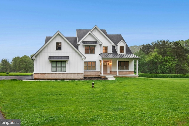 385 Nolf Rd, Nazareth, PA 18064 - modern farmhouse style home featuring a standing seam roof, a front yard, a porch, and metal roof