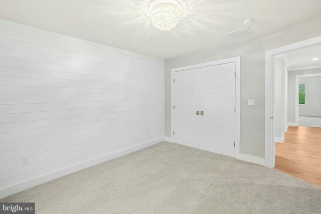 385 Nolf Rd, Nazareth, PA 18064 - unfurnished bedroom featuring baseboards, light carpet, a chandelier, and a closet