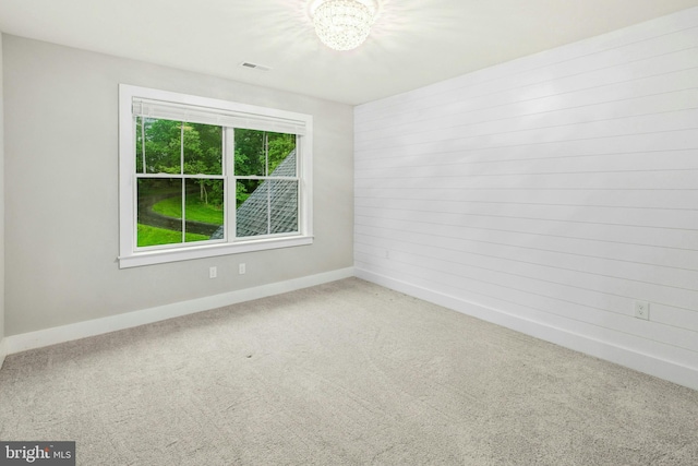385 Nolf Rd, Nazareth, PA 18064 - carpeted spare room with baseboards and a chandelier