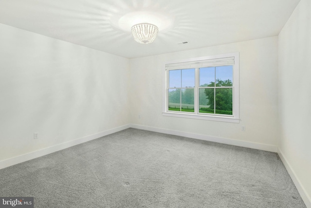 385 Nolf Rd, Nazareth, PA 18064 - carpeted empty room with baseboards and a chandelier