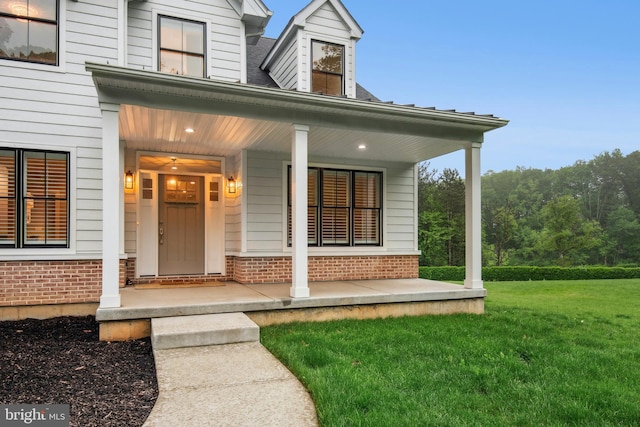 385 Nolf Rd, Nazareth, PA 18064 - entrance to property featuring brick siding, a porch, and a lawn