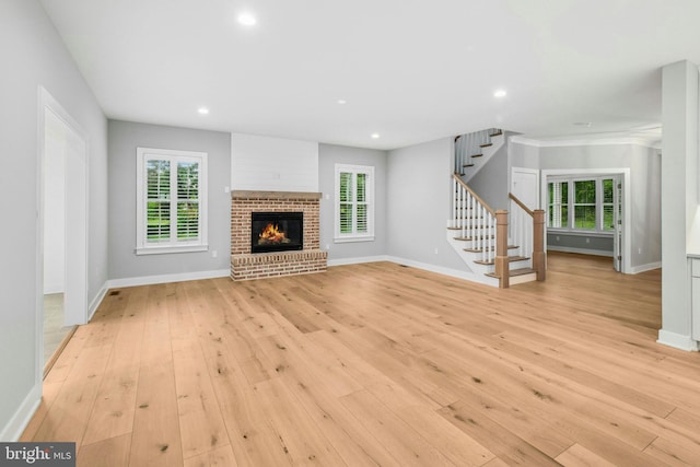 385 Nolf Rd, Nazareth, PA 18064 - unfurnished living room with stairway, light wood finished floors, baseboards, plenty of natural light, and recessed lighting