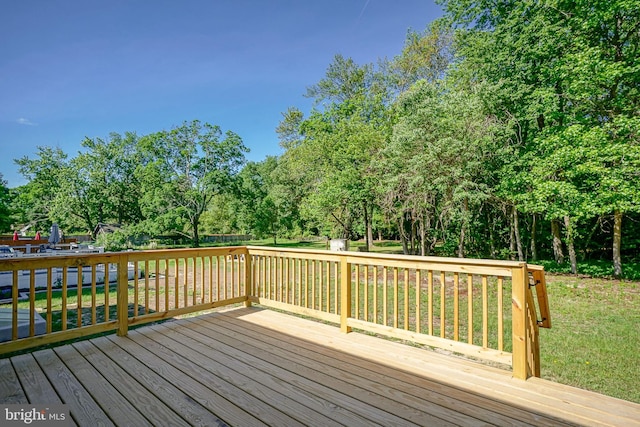 360 N Broad St, Clayton, NJ 08312 - wooden deck featuring view of wooded area and a yard