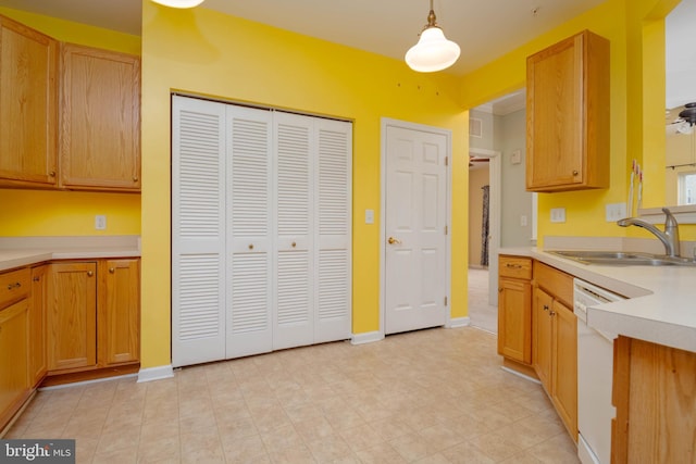 130 W Broadway Unit 1D, Bel Air, MD 21014 - kitchen featuring a sink, dishwasher, light countertops, hanging light fixtures, and baseboards