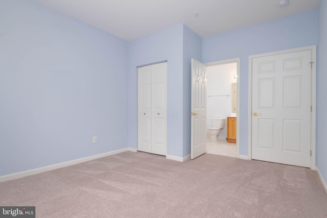 130 W Broadway Unit 1D, Bel Air, MD 21014 - unfurnished bedroom with carpet floors, a closet, baseboards, and ensuite bathroom