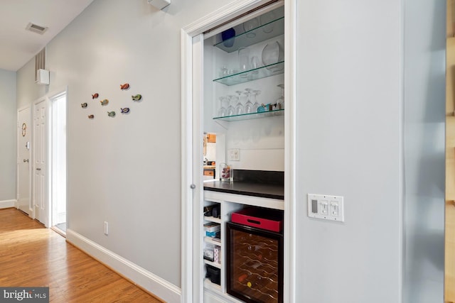 2001 19th St NW Unit 10, Washington, DC 20009 - corridor with wood finished floors, baseboards, and wine cooler