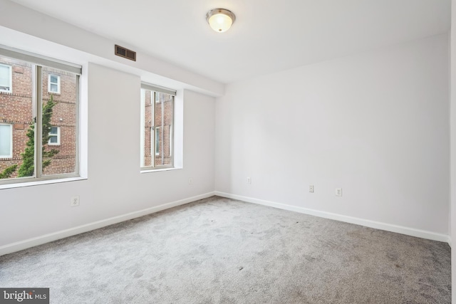 5401 9th St NW Unit 202, Washington, DC 20011 - carpeted spare room featuring baseboards