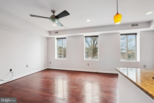 5401 9th St NW Unit 202, Washington, DC 20011 - empty room featuring healthy amount of natural light, ceiling fan, dark wood finished floors, baseboards, and recessed lighting
