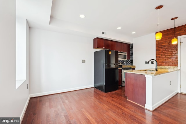 5401 9th St NW Unit 202, Washington, DC 20011 - kitchen with stainless steel appliances, a peninsula, a sink, dark wood-style floors, and decorative backsplash