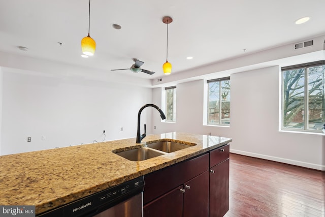 5401 9th St NW Unit 202, Washington, DC 20011 - kitchen featuring a sink, stainless steel dishwasher, decorative light fixtures, dark wood-type flooring, and light stone countertops