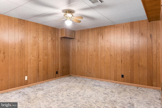 30 Towns Ct, Baltimore, MD 21237 - empty room featuring wood walls, ceiling fan, a drop ceiling, and carpet flooring