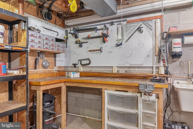 30 Towns Ct, Baltimore, MD 21237 - basement featuring a workshop area and a sink