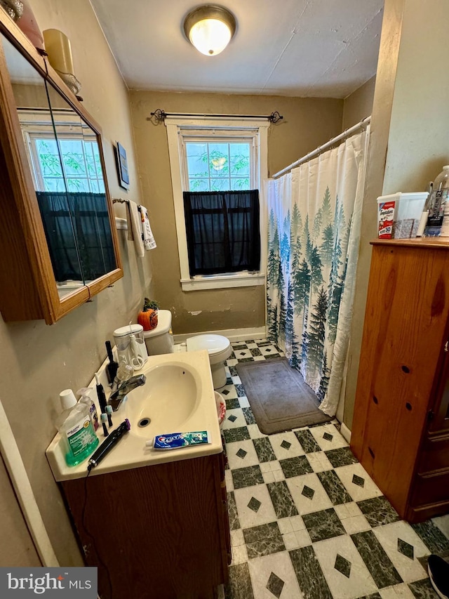 5569 Bouquet St, Huntingdon, PA 16652 - full bath featuring tile patterned floors, vanity, curtained shower, and toilet