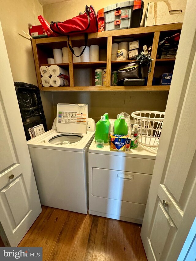 5569 Bouquet St, Huntingdon, PA 16652 - clothes washing area with washing machine and dryer and dark wood-style floors