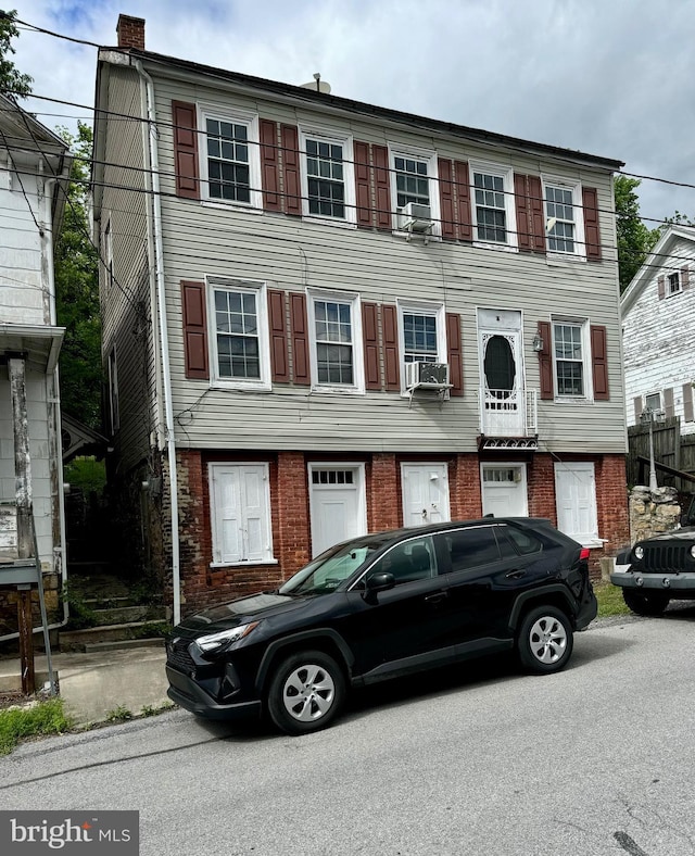 5569 Bouquet St, Huntingdon, PA 16652 - multi unit property with brick siding, a chimney, and cooling unit
