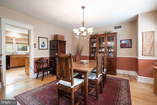550 Somerton Ave, Philadelphia, PA 19116 - dining room with a chandelier, light wood-style floors, and baseboards