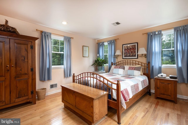 550 Somerton Ave, Philadelphia, PA 19116 - bedroom featuring multiple windows, light wood-style flooring, and baseboards