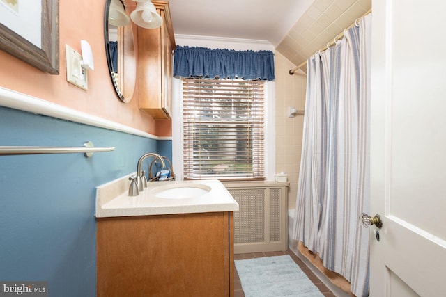 550 Somerton Ave, Philadelphia, PA 19116 - full bathroom featuring vanity, shower / bath combination with curtain, radiator heating unit, and lofted ceiling