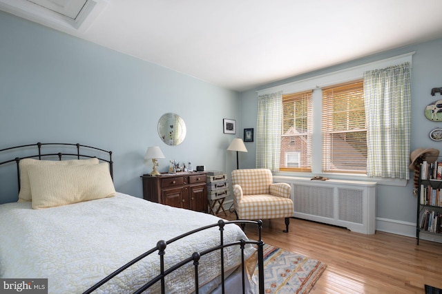 550 Somerton Ave, Philadelphia, PA 19116 - bedroom featuring radiator heating unit, wood finished floors, and baseboards