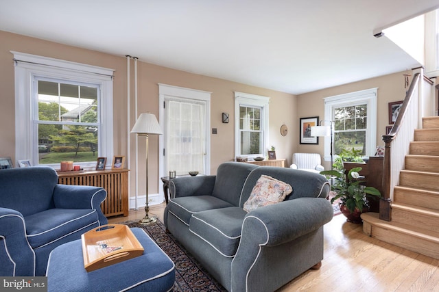 550 Somerton Ave, Philadelphia, PA 19116 - living room featuring wood finished floors, stairway, and radiator