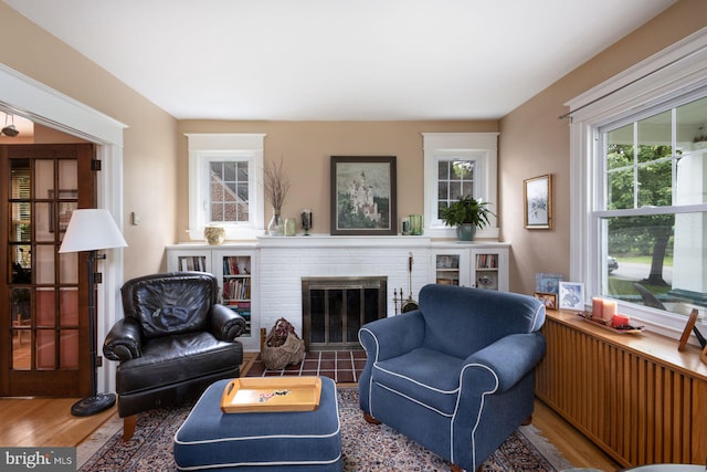 550 Somerton Ave, Philadelphia, PA 19116 - living room featuring wood finished floors, plenty of natural light, and a brick fireplace