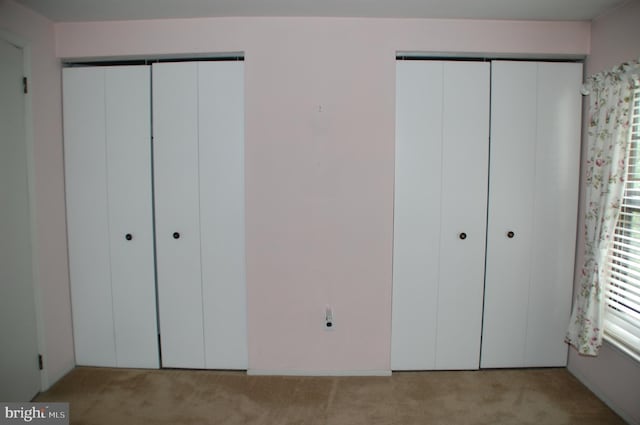 404 Franklin Ct, North Wales, PA 19454 - unfurnished bedroom with light colored carpet and multiple closets