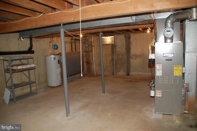 404 Franklin Ct, North Wales, PA 19454 - unfinished below grade area featuring electric water heater, oil tank, and heating unit