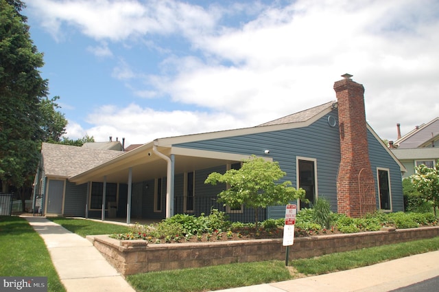 404 Franklin Ct, North Wales, PA 19454 - view of front of house with a shingled roof and a chimney