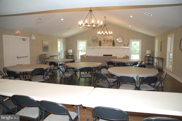 404 Franklin Ct, North Wales, PA 19454 - dining area with lofted ceiling, wood finished floors, a chandelier, plenty of natural light, and baseboards