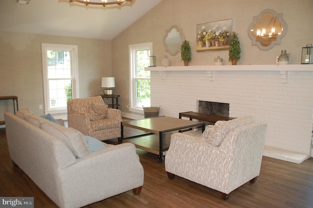 404 Franklin Ct, North Wales, PA 19454 - living room featuring a chandelier, lofted ceiling, wood finished floors, and a fireplace