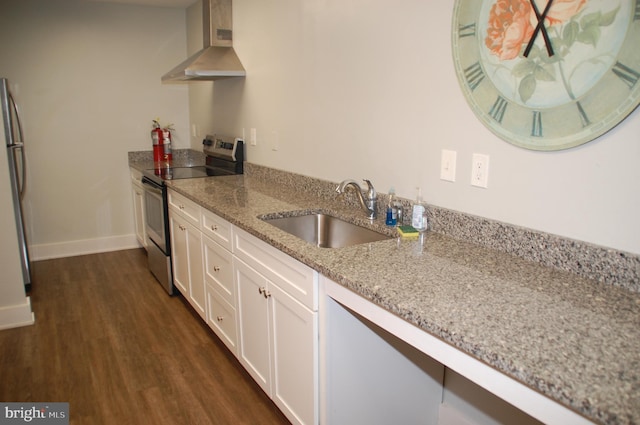 404 Franklin Ct, North Wales, PA 19454 - kitchen featuring stainless steel appliances, a sink, wall chimney exhaust hood, dark wood-style floors, and white cabinetry