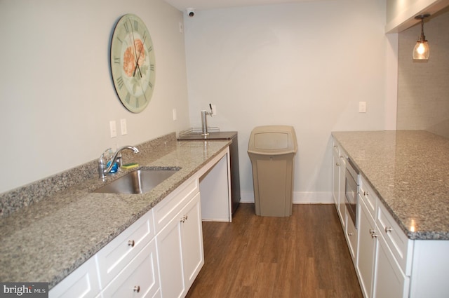 404 Franklin Ct, North Wales, PA 19454 - kitchen with a sink, dark wood finished floors, a peninsula, white cabinets, and light stone countertops