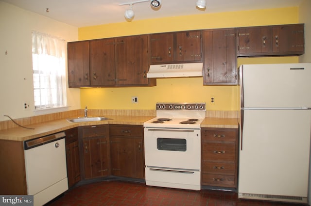 404 Franklin Ct, North Wales, PA 19454 - kitchen featuring white appliances, under cabinet range hood, a sink, light countertops, and brick patterned floors