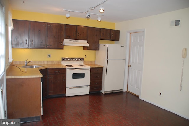 404 Franklin Ct, North Wales, PA 19454 - kitchen with white appliances, under cabinet range hood, a sink, light countertops, and brick patterned floors