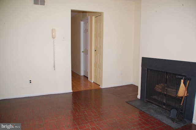 404 Franklin Ct, North Wales, PA 19454 - unfurnished living room with a fireplace with raised hearth, brick patterned floors, and baseboards