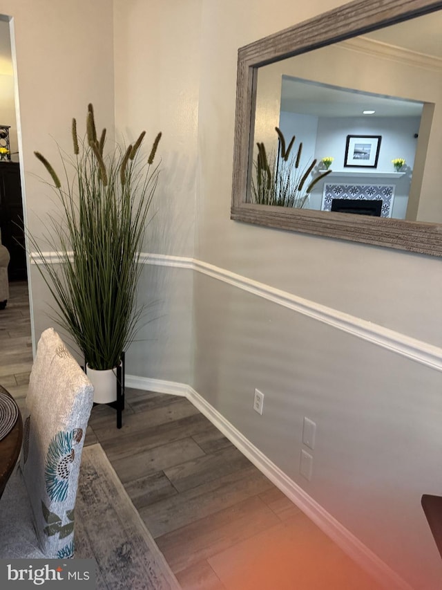 1004 Blackwell, Annapolis, MD 21403 - detailed view of wood finished floors, baseboards, a fireplace, and crown molding