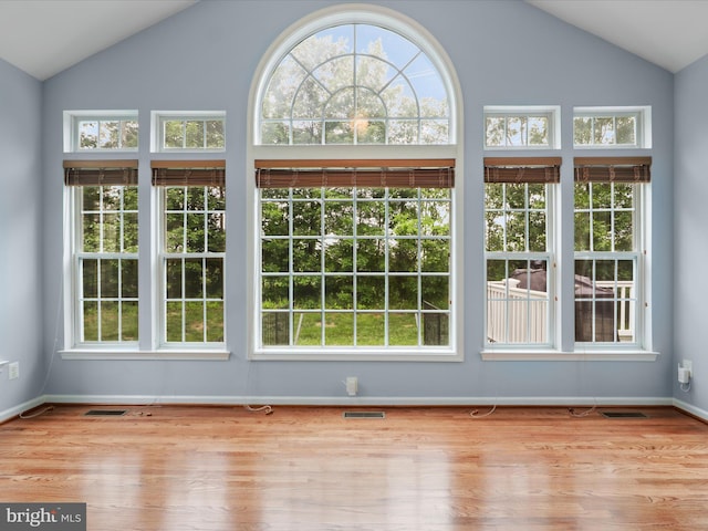 9499 Ballagan Ct, Bristow, VA 20136 - unfurnished sunroom featuring lofted ceiling and plenty of natural light