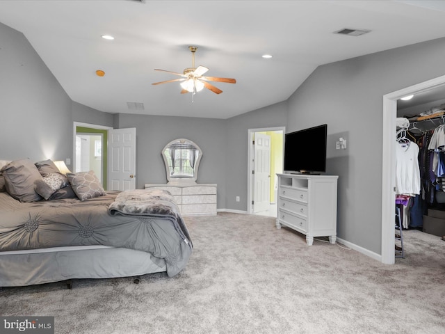 9499 Ballagan Ct, Bristow, VA 20136 - carpeted bedroom with a spacious closet, vaulted ceiling, a closet, baseboards, and ceiling fan