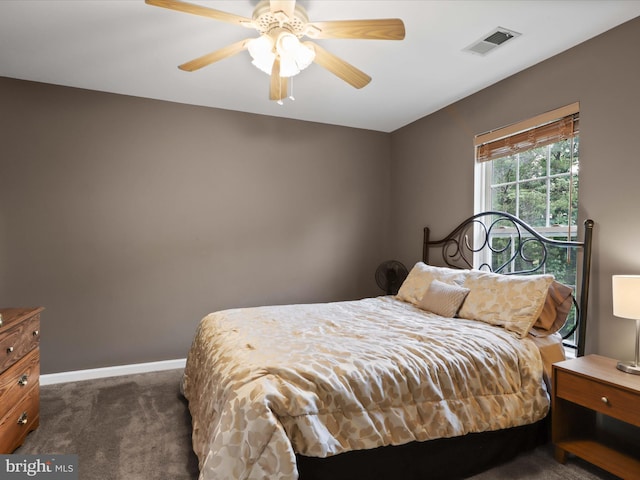9499 Ballagan Ct, Bristow, VA 20136 - bedroom with dark colored carpet, baseboards, and a ceiling fan