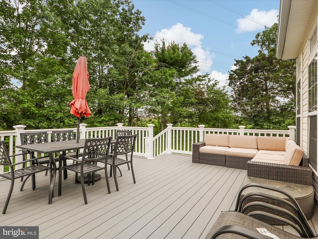 9499 Ballagan Ct, Bristow, VA 20136 - wooden deck featuring outdoor dining space, an outdoor living space, and view of scattered trees