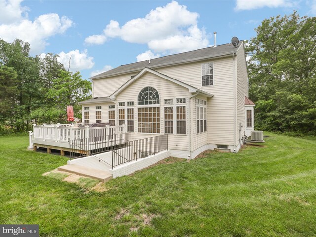9499 Ballagan Ct, Bristow, VA 20136 - rear view of property featuring a wooden deck, cooling unit, and a yard