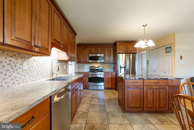 221 Shirley, Jeffersonville, PA 19403 - kitchen with appliances with stainless steel finishes, a sink, brown cabinets, and a chandelier