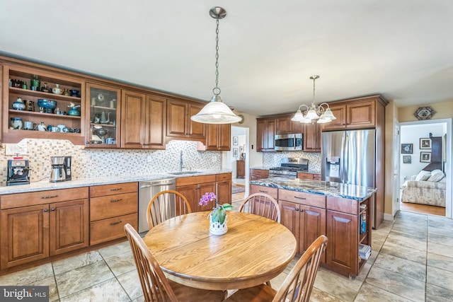 221 Shirley, Jeffersonville, PA 19403 - kitchen featuring stainless steel appliances, open shelves, a sink, decorative backsplash, and a chandelier